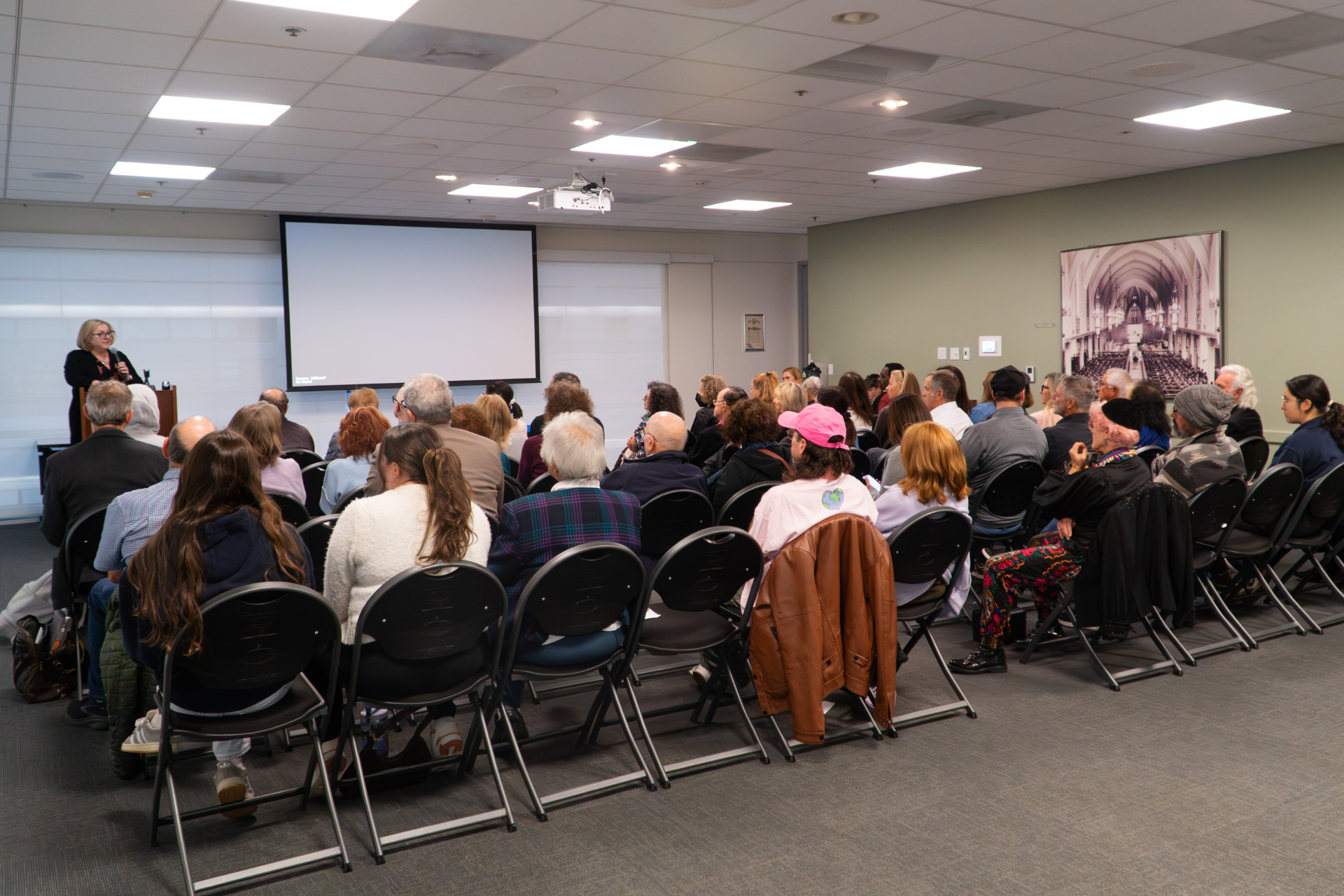 Dr. Maragrete Feinstein Presenting To Audience